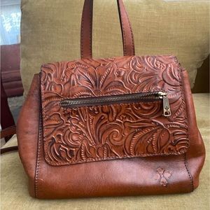 Leather book bag/purse. Floral tooling detail. Plenty of space. Rarely used